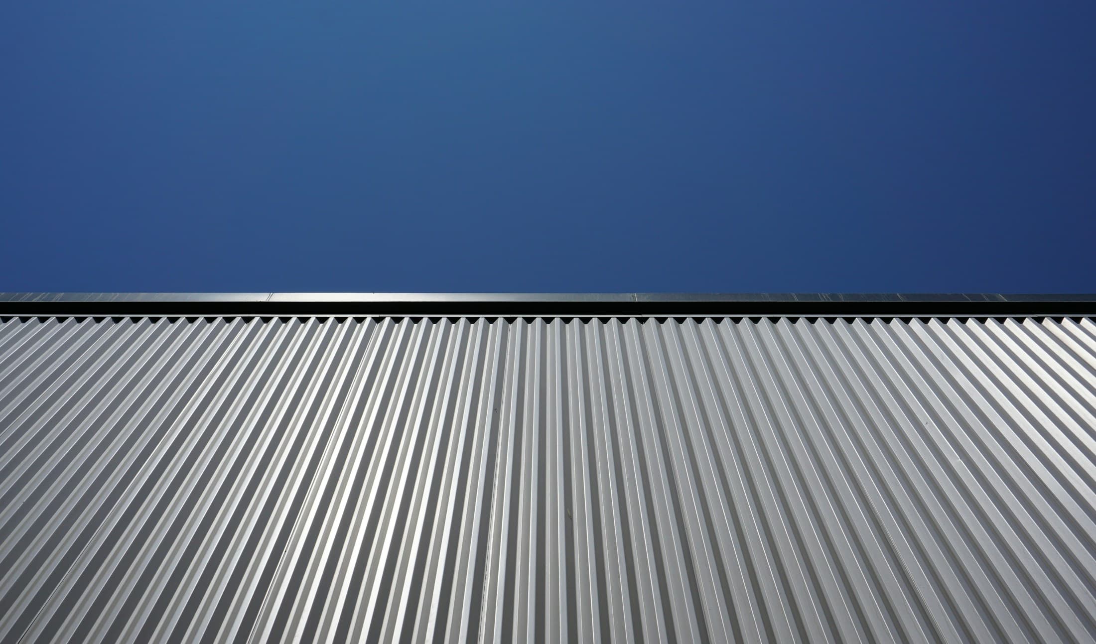 Metal roof seams against open sky