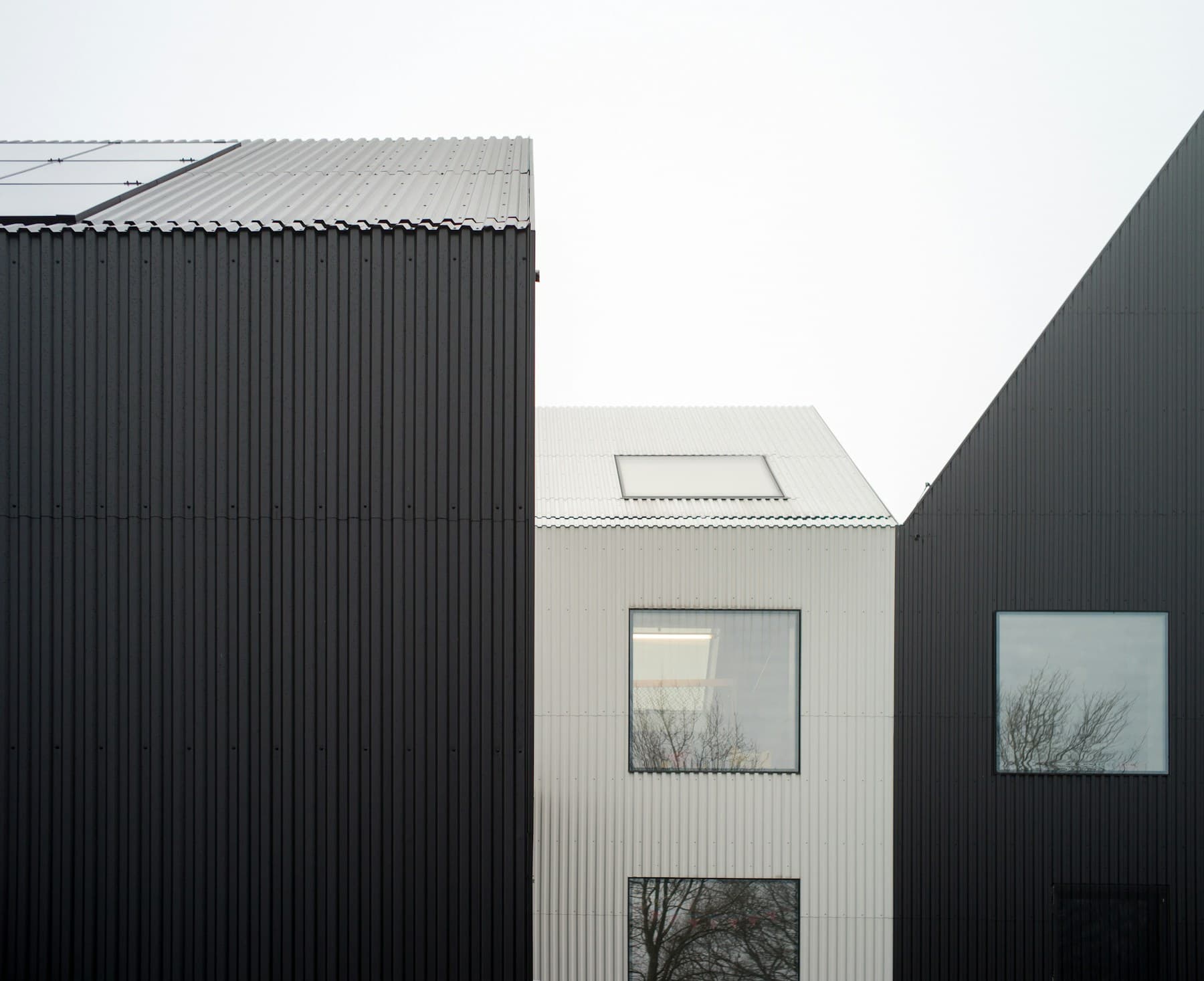 Black and white corrugated metal gable roofs